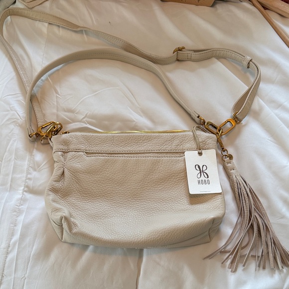HOBO Handbags - HOBO Cream Leather Crossbody with Tassel Detail